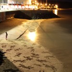 sand drawings on the beach at night