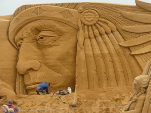Giant sand sculpture of and Indian face