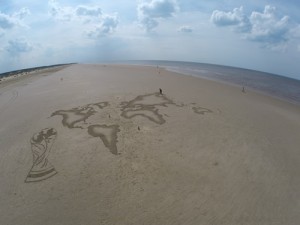 sand drawing of a map of the world