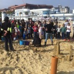 The crowds gathered for the sand sculpture demonstration