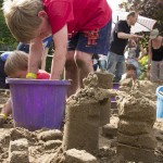 Kids enjoying the sand sculpture workshops at the festival
