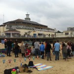 The crowds gathered for the sand sculpture demonstration