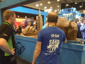 UK sand sculptor Jamie Wardley sculpting live at the trade show event