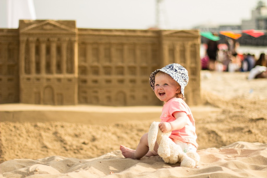 Florence with the beach sand sculpture of Buckingham Palace to celebrate the Queen's 90th Birthday