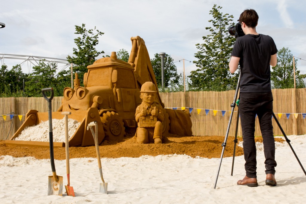 Photographer photographs The Bob the builder sand sculpture on the city beach in Stratford