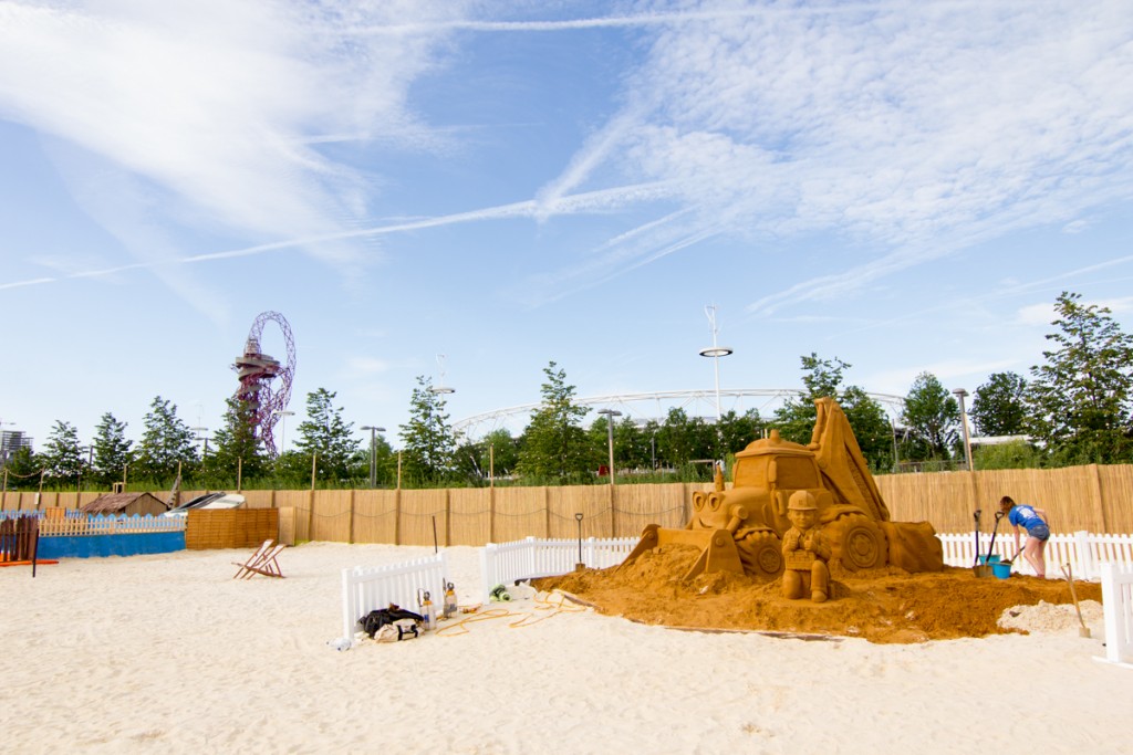 Giant Bob The Builder sand sculpture at an urban beach event London