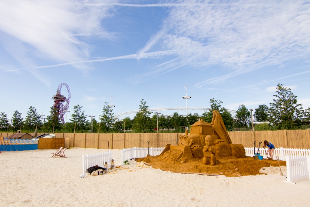 Giant Bob The Builder sand sculpture at an urban beach event London