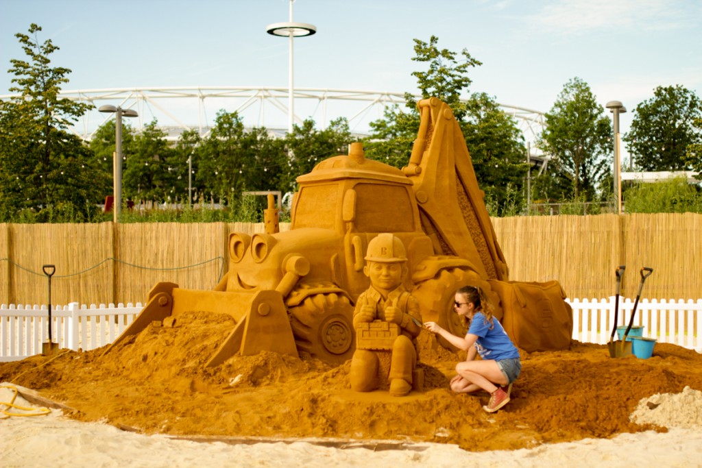 Claire Jamieson with Bob the Builder sand sculpture, at beach east stratford, by Sand In Your Eye